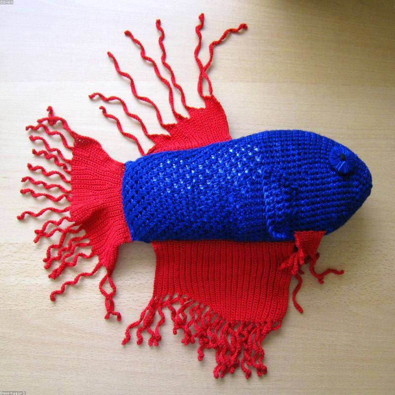 Bucket Hat held in hands demonstrating tactile plush scale and soft texture