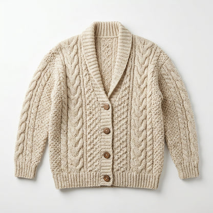 Cardigan held in hands demonstrating tactile plush scale and soft texture