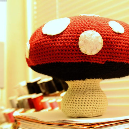 Red Amanita Forest Mushroom Pattern held in hands demonstrating tactile plush scale and soft texture