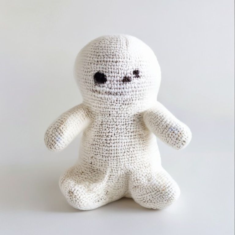 Ghost held in hands demonstrating tactile plush scale and soft texture