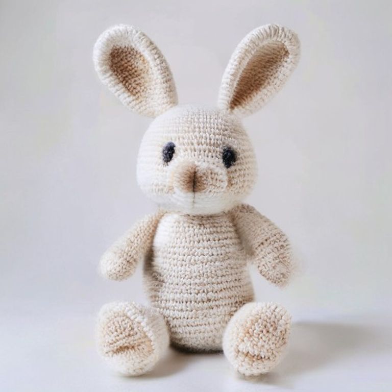 Flora Bunny Rabbit Pattern held in hands demonstrating tactile plush scale and soft texture