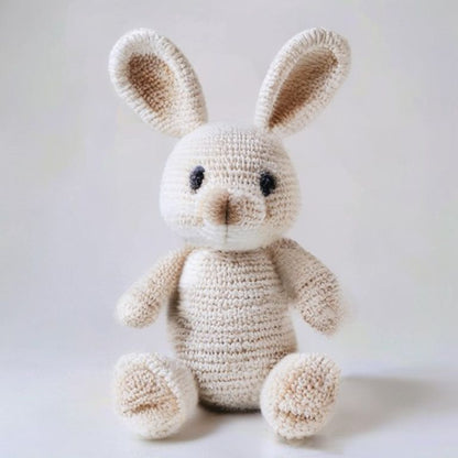 Flora Bunny Rabbit Pattern held in hands demonstrating tactile plush scale and soft texture