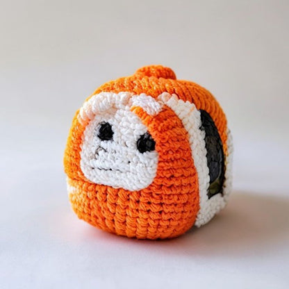 Sushi held in hands demonstrating tactile plush scale and soft texture