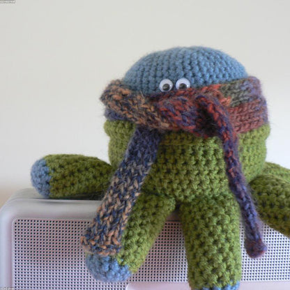 Witch Hat held in hands demonstrating tactile plush scale and soft texture